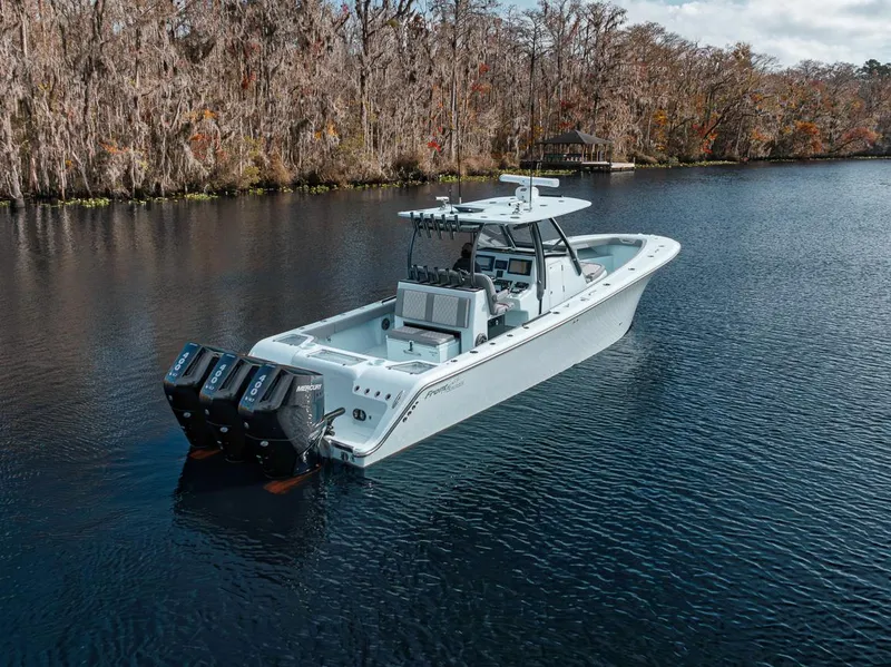 Slide: The Image of 2024 Front Runner 36 Center Console boat on a serene lake. - 15