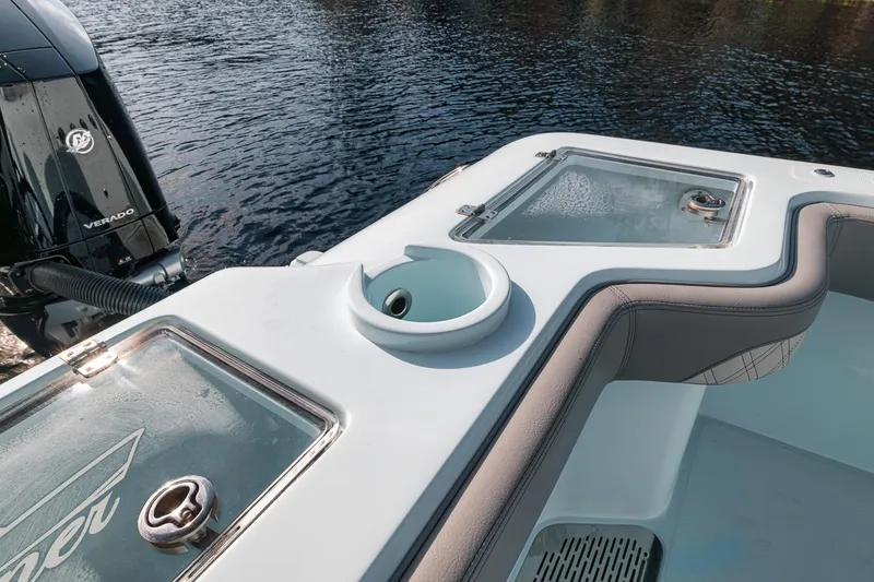Slide: The Image of 2024 Front Runner 36 Center Console boat with livewell and rod holders on deck. - 24