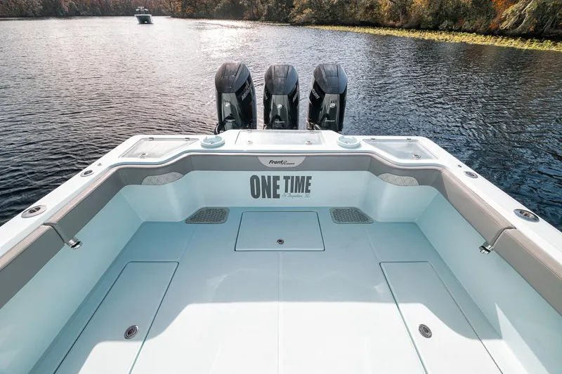 Slide: The Image of 2024 Front Runner 36 Center Console boat on a serene lake. - 27