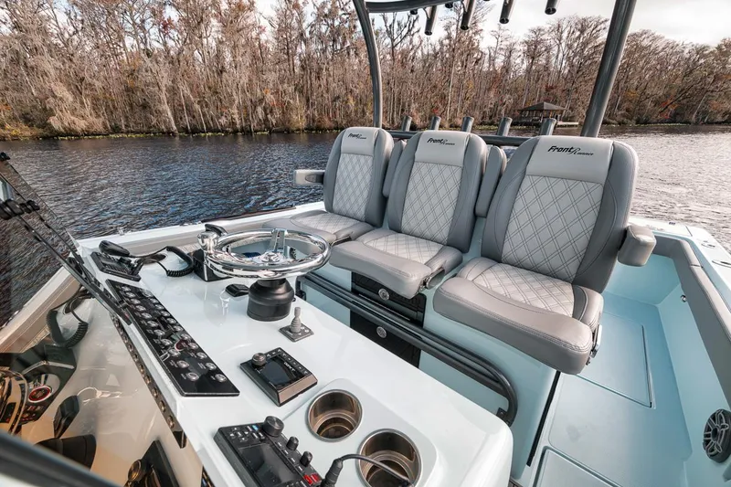 Slide: The Image of 2024 Front Runner 36 Center Console boat interior with luxurious seating and control panel. - 30