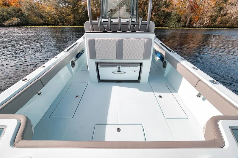 Slide: The Image of 2024 Front Runner 36 Center Console boat interior on a calm lake. - 34