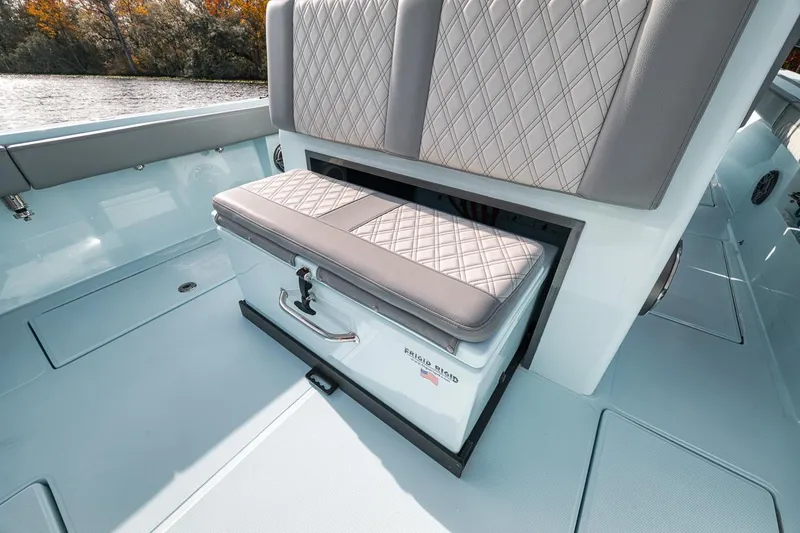 Slide: The Image of 2024 Front Runner 36 Center Console boat interior with cushioned seating and storage. - 35