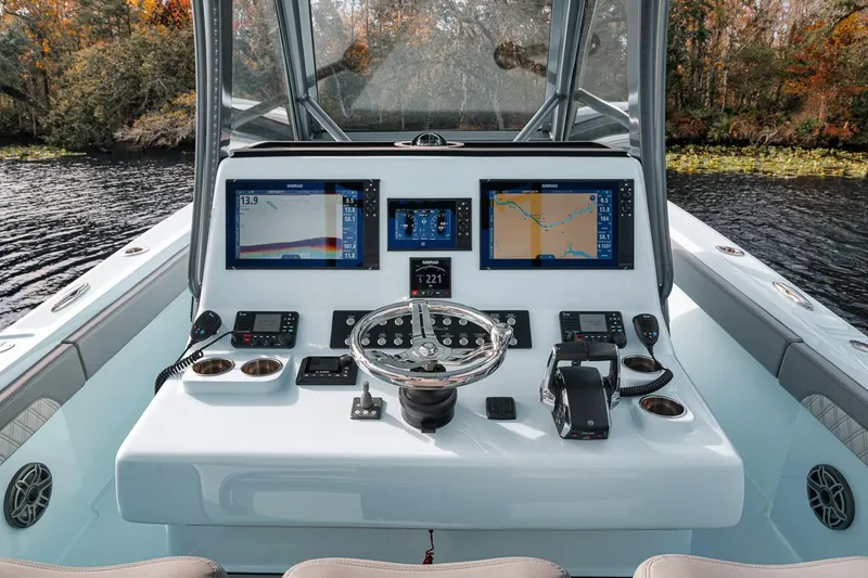 Slide: The Image of 2024 Front Runner 36 Center Console boat dashboard with advanced navigation displays. - 41