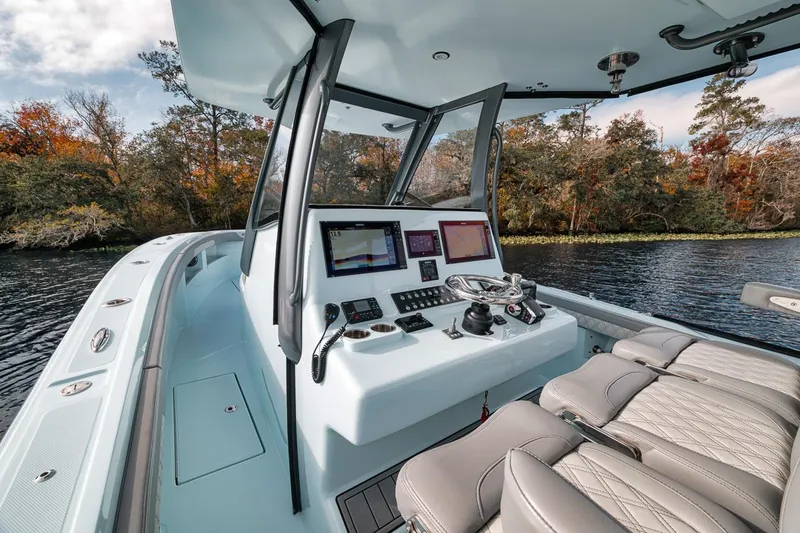 Slide: The Image of 2024 Front Runner 36 Center Console boat interior with advanced navigation system. - 42