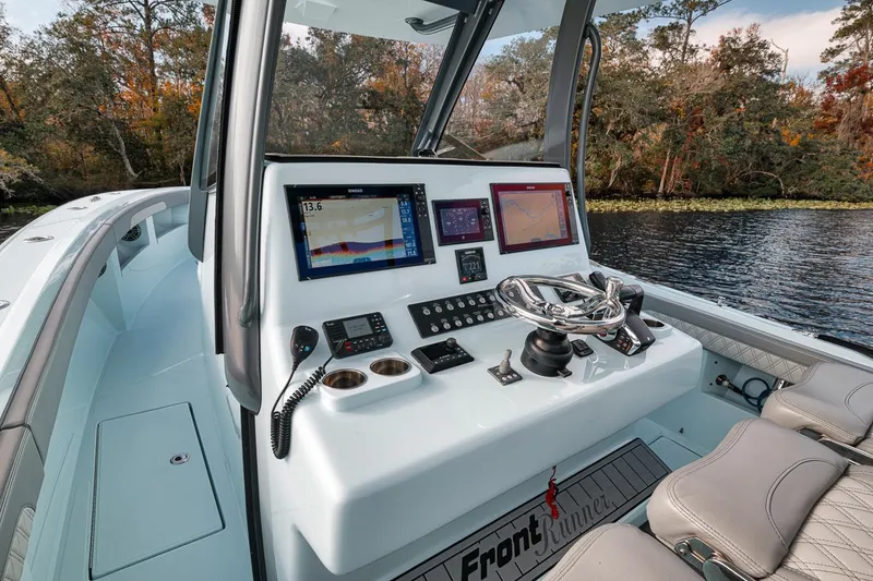 Slide: The Image of 2024 Front Runner 36 Center Console boat dashboard with advanced navigation systems. - 43