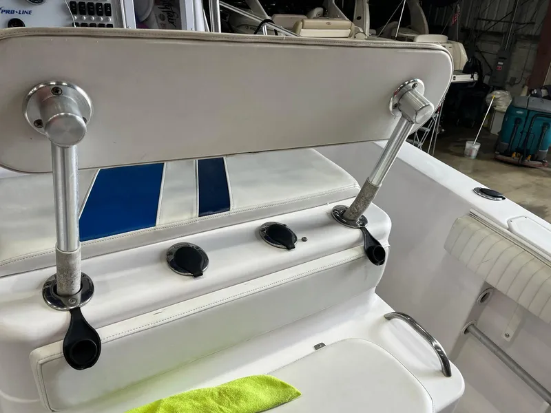 Slide: The Image of 2001 Pro-Line 25 Sport boat seating with adjustable backrest and cup holders. - 20