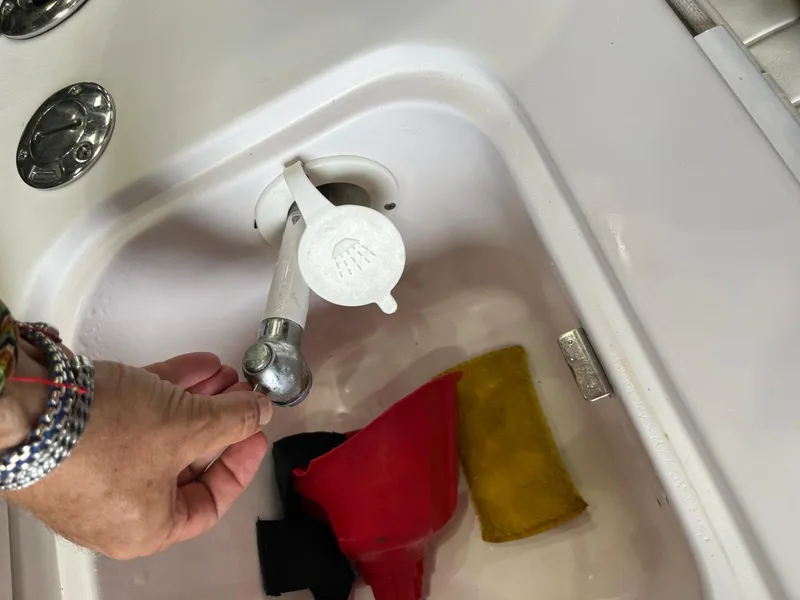 Slide: The Image of Hand operating faucet in Pro-Line 25 Sport boat sink, 2001 model. - 33