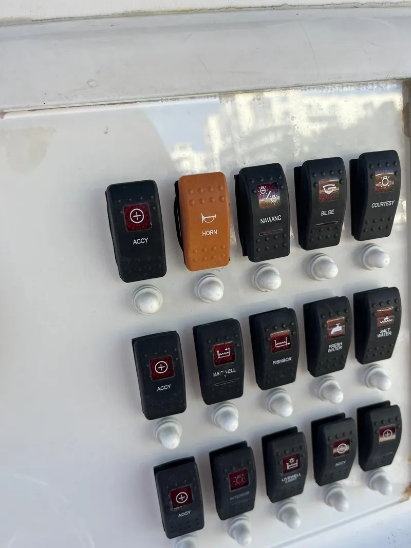 Slide: The Image of Control panel switches on a 2001 Pro-Line 25 Sport boat. - 36