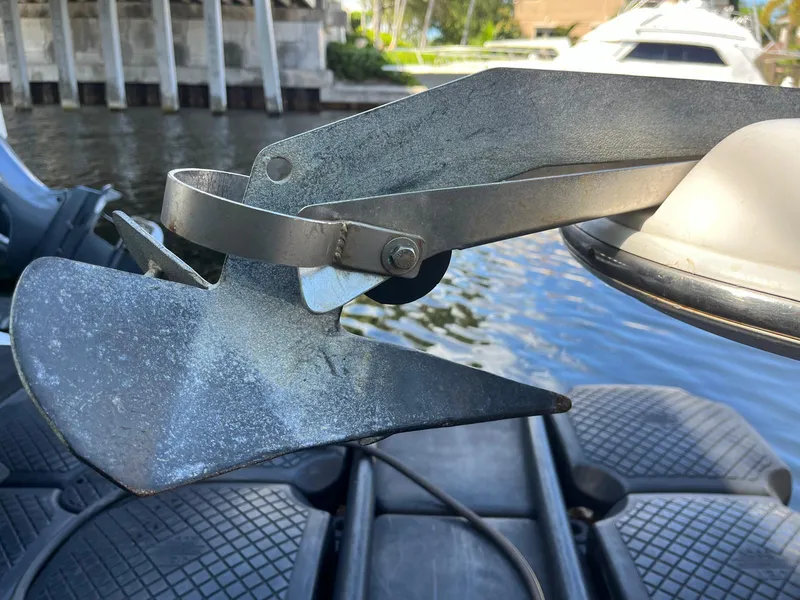 Slide: The Image of Close-up of a 2001 Pro-Line 25 Sport boat anchor near water. - 39
