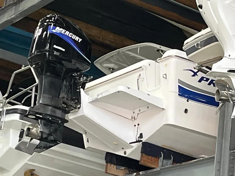 Slide: The Image of 2001 Pro-Line 25 Sport boat with Mercury outboard motor in storage. - 4