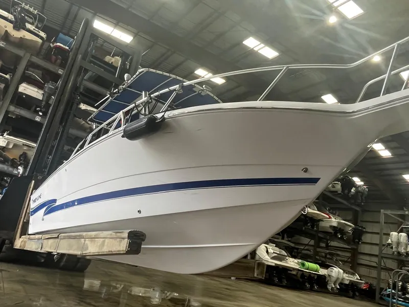 Slide: The Image of 2001 Pro-Line 25 Sport boat in storage facility, side view. - 7