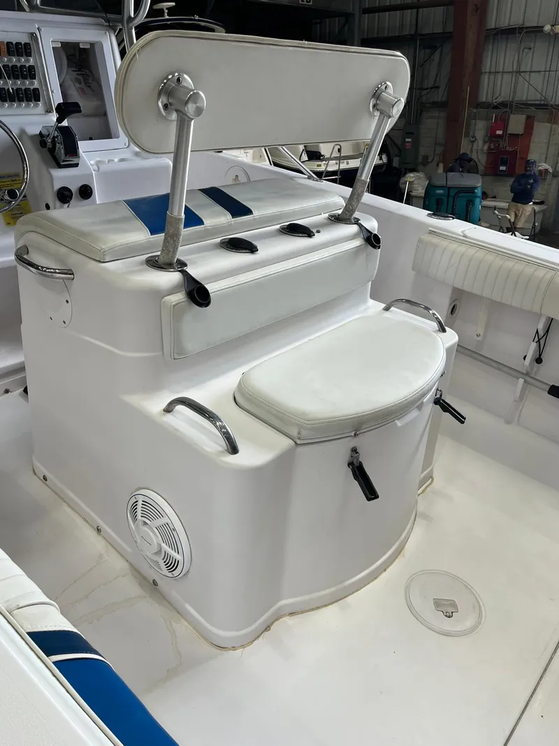 Slide: The Image of 2001 Pro-Line 25 Sport boat interior with seating and control panel. - 9