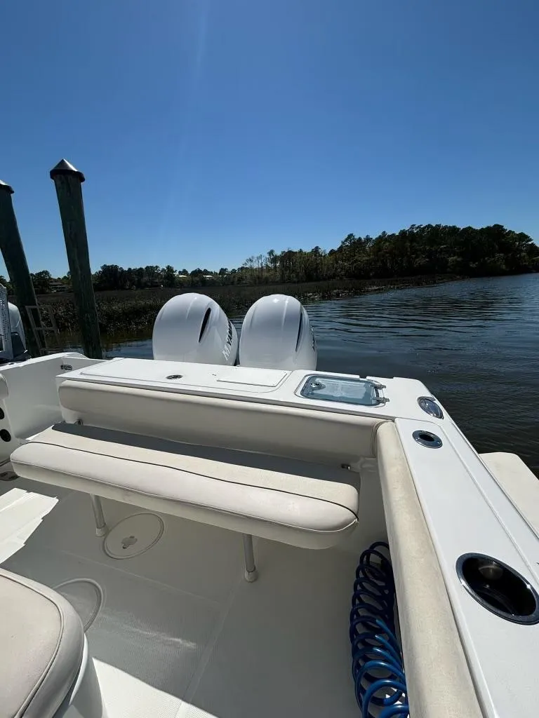 Slide: The Image of 2014 Sea Hunt Gamefish 27 boat with forward seating on a sunny day. - 3