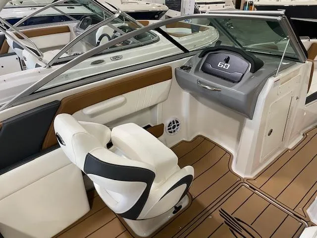 Slide: The Image of 2025 Chaparral 21 SSi OB boat interior with modern dashboard and seating. - 10