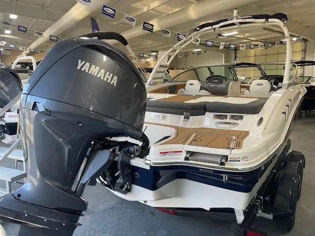 Slide: The Image of 2025 Chaparral 21 SSi OB boat with Yamaha outboard motor in showroom. - 2
