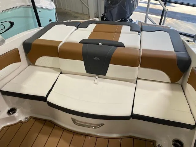 Slide: The Image of 2025 Chaparral 21 SSi OB boat interior with stylish brown and white seating. - 5