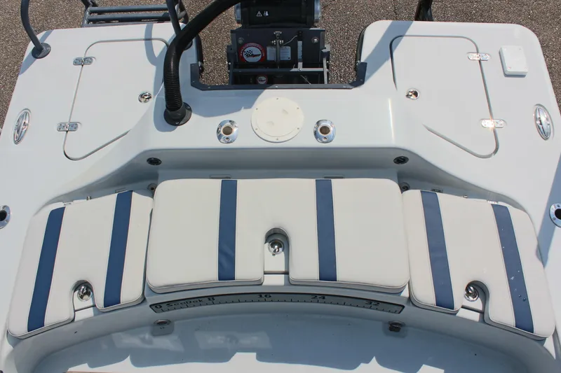 Slide: The Image of 2017 Tiburon ZX-25 boat deck with cushioned seating and control panel. - 13