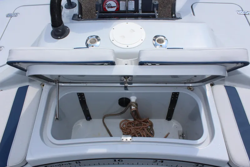 Slide: The Image of Open storage compartment on 2017 Tiburon ZX-25 boat with ropes inside. - 15