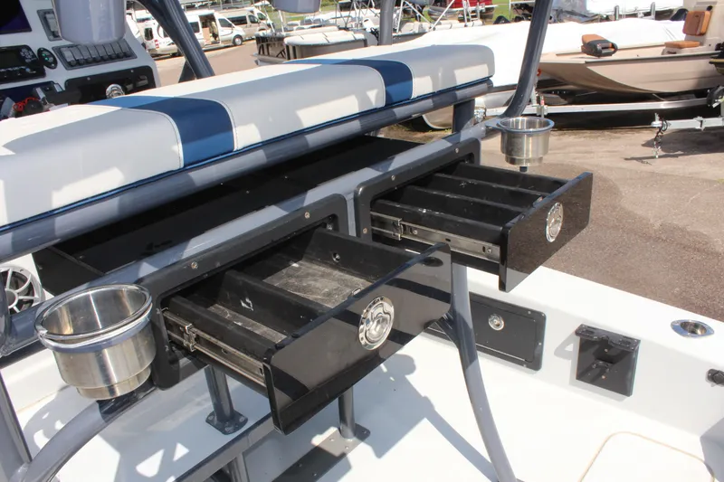 Slide: The Image of 2017 Tiburon ZX-25 boat with open storage compartments and cup holders. - 19