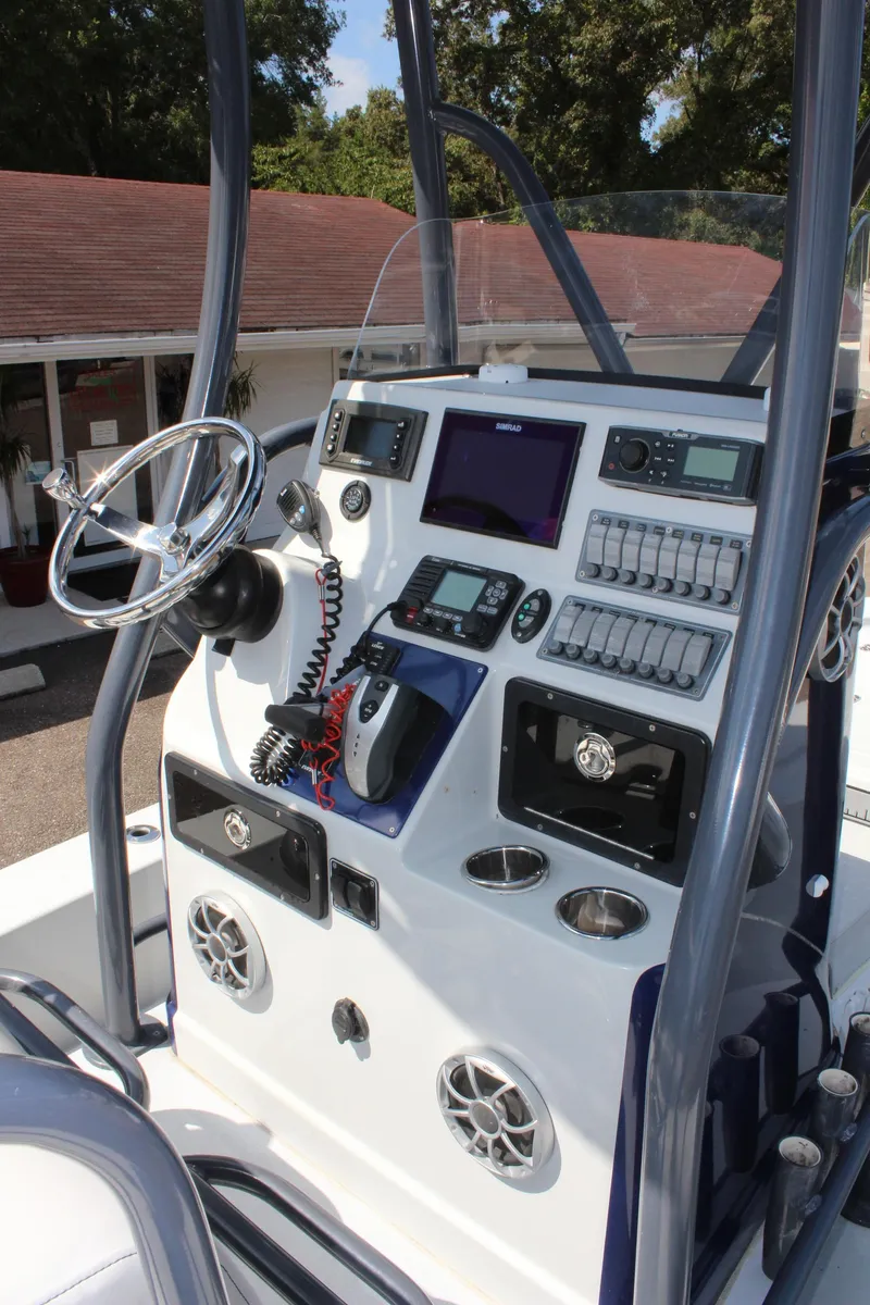 Slide: The Image of 2017 Tiburon ZX-25 boat console with advanced navigation and control systems. - 22