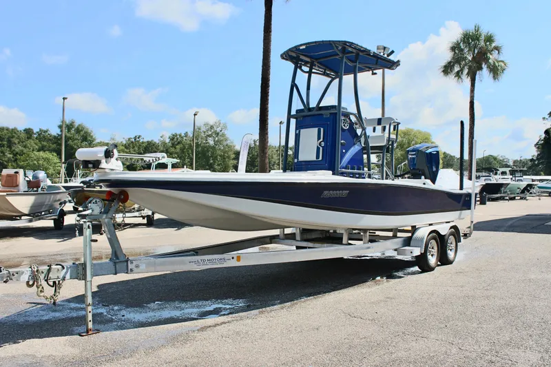 Slide: The Image of 2017 Tiburon ZX-25 boat on trailer in sunny outdoor setting. - 3