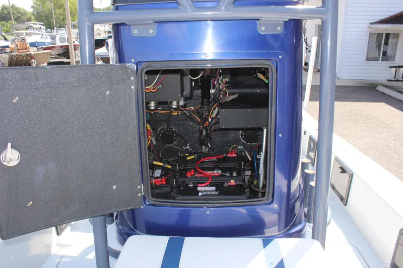 Slide: The Image of Open electrical compartment on 2017 Tiburon ZX-25 boat, showing wiring and components. - 34