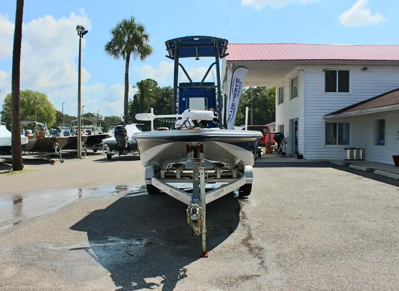 Slide: The Image of 2017 Tiburon ZX-25 boat on trailer in marina parking lot. - 4