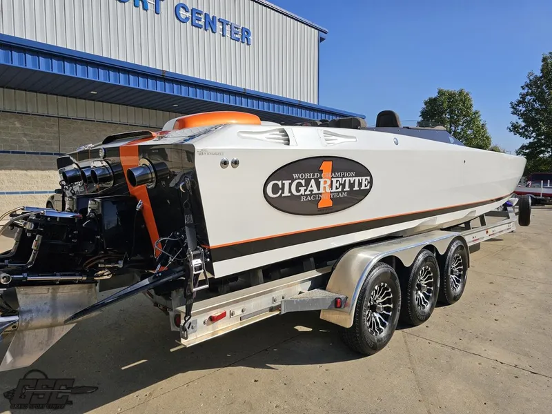 Slide: The Image of 2003 Cigarette 36 Gladiator speedboat on trailer at a sport center. - 12