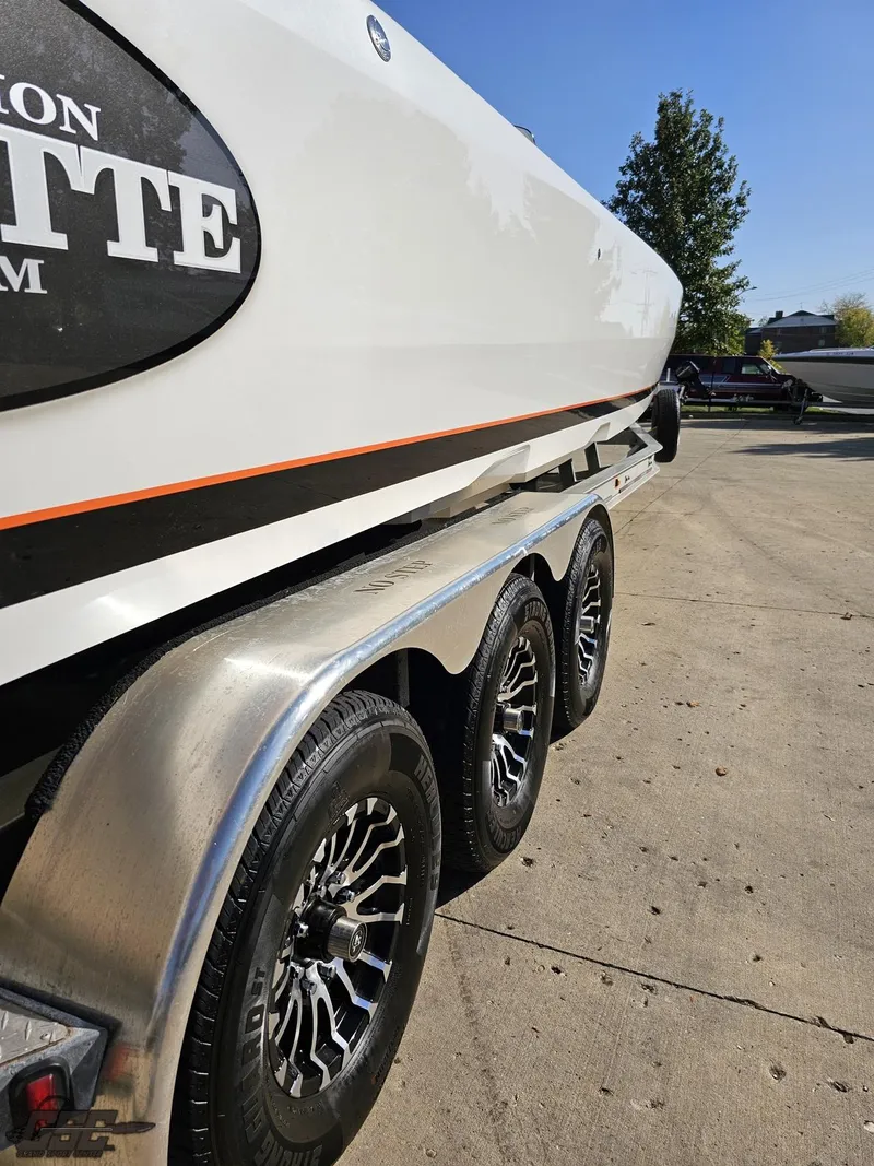 Slide: The Image of 2003 Cigarette 36 Gladiator boat on trailer, side view, sunny day. - 15