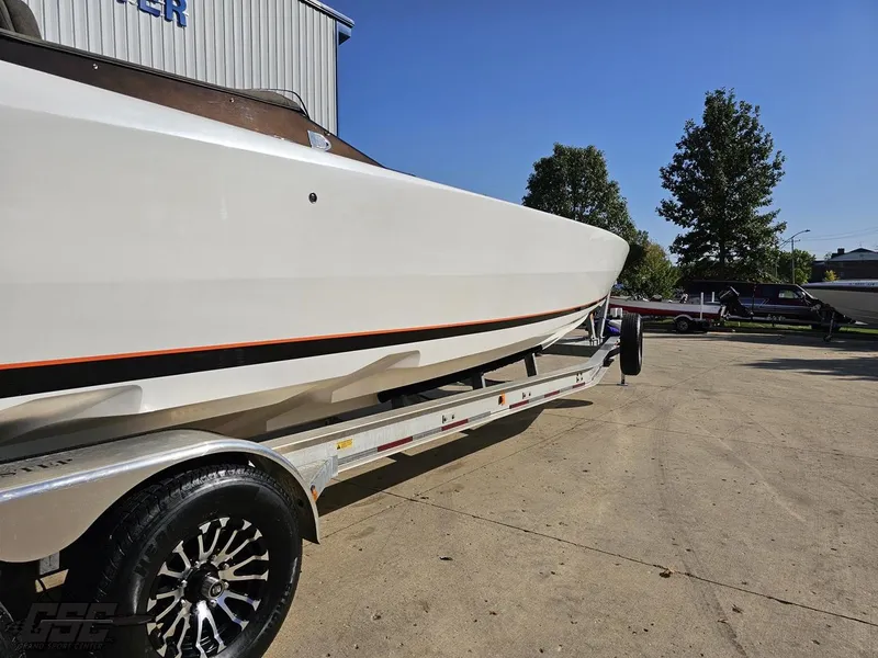 Slide: The Image of 2003 Cigarette 36 Gladiator boat on trailer, outdoor setting. - 16