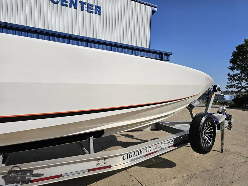 Slide: The Image of 2003 Cigarette 36 Gladiator boat on trailer outside marine center. - 17