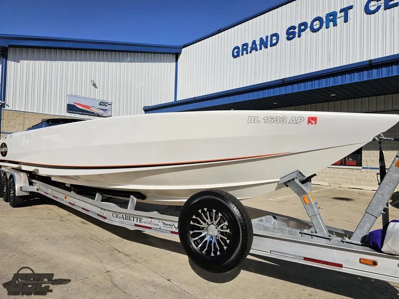 Slide: The Image of 2003 Cigarette 36 Gladiator boat on trailer at Grand Sport Center. - 18