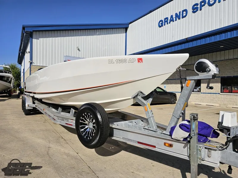Slide: The Image of 2003 Cigarette 36 Gladiator boat on trailer outside Grand Sport Center. - 19