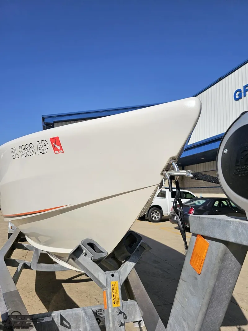 Slide: The Image of 2003 Cigarette 36 Gladiator boat on trailer under clear blue sky. - 20