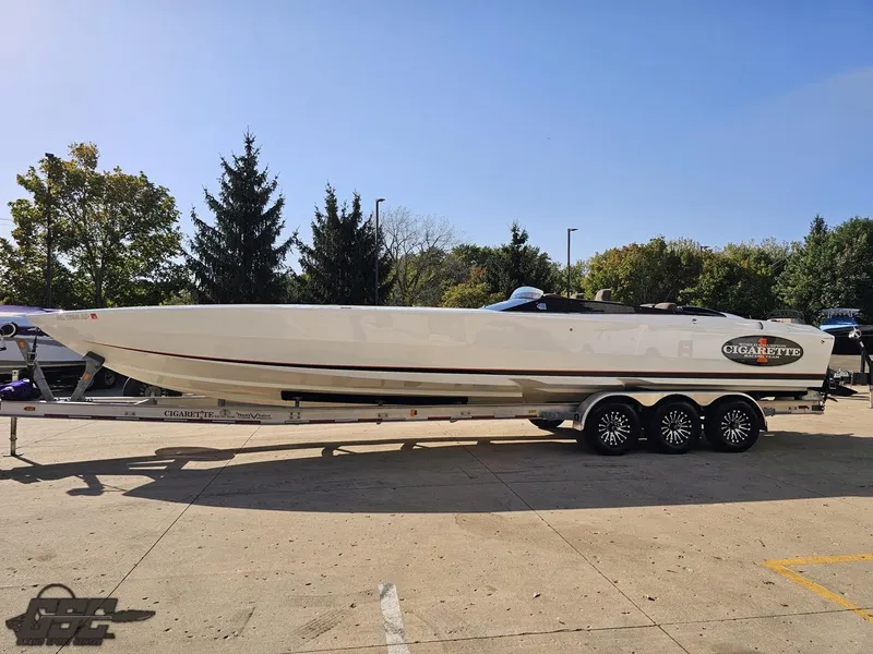 Slide: The Image of 2003 Cigarette 36 Gladiator speedboat on trailer, parked outdoors. - 25