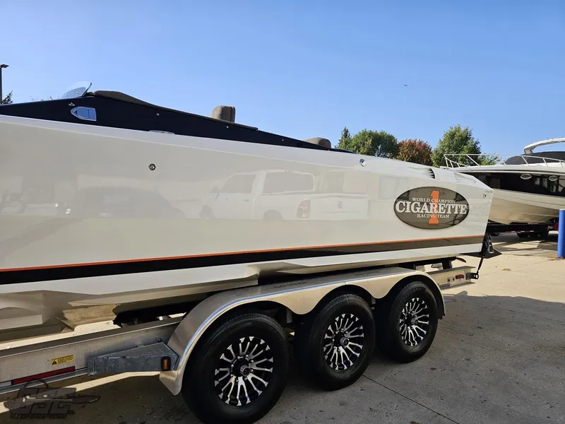 Slide: The Image of 2003 Cigarette 36 Gladiator boat on trailer, side view. - 29