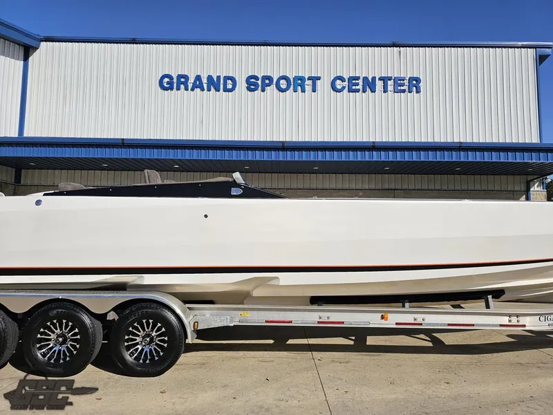 Slide: The Image of 2003 Cigarette 36 Gladiator boat on trailer at Grand Sport Center. - 3