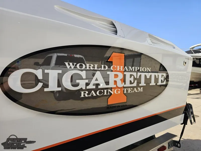Slide: The Image of 2003 Cigarette 36 Gladiator boat with "World Champion Racing Team" logo. - 30