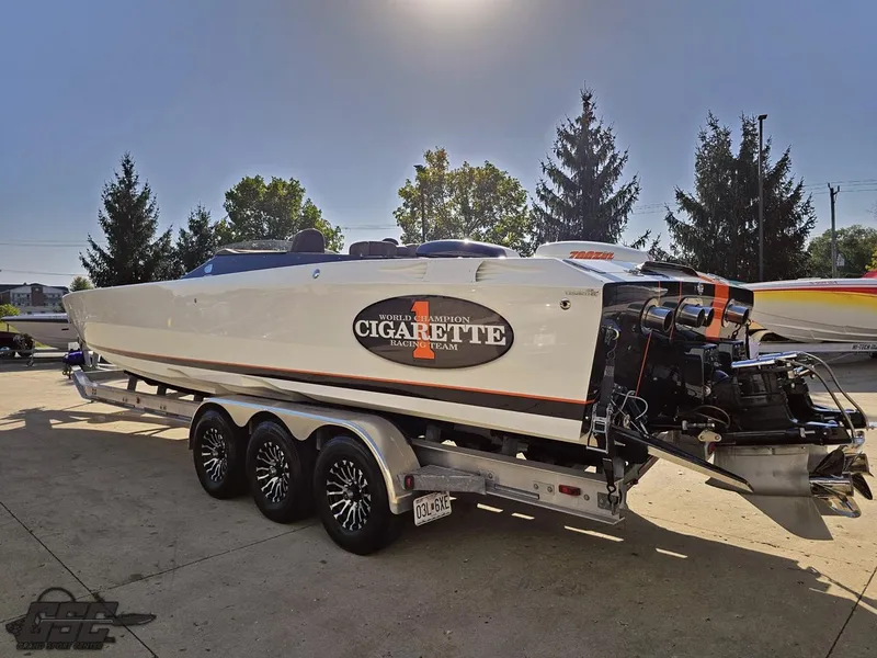 Slide: The Image of 2003 Cigarette 36 Gladiator speedboat on trailer, parked outdoors. - 34