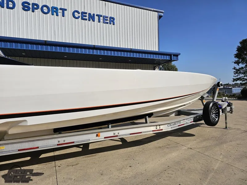Slide: The Image of 2003 Cigarette 36 Gladiator boat on trailer at sport center. - 4