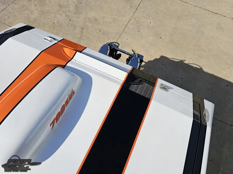 Slide: The Image of 2003 Cigarette 36 Gladiator boat with orange and black stripes on deck. - 45