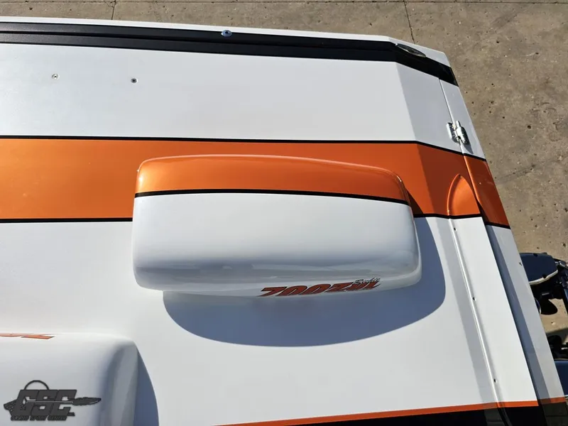 Slide: The Image of 2003 Cigarette 36 Gladiator boat with orange and white design, top view. - 46