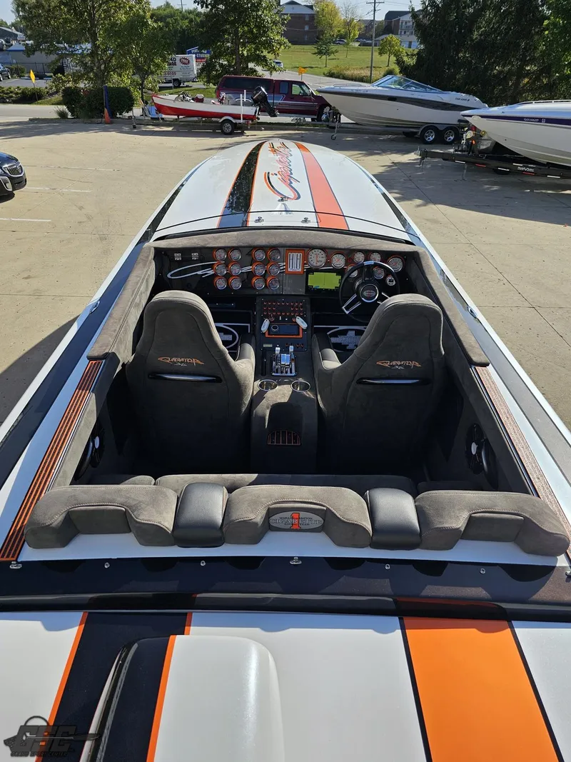 Slide: The Image of 2003 Cigarette 36 Gladiator boat interior with sleek design and advanced controls. - 49