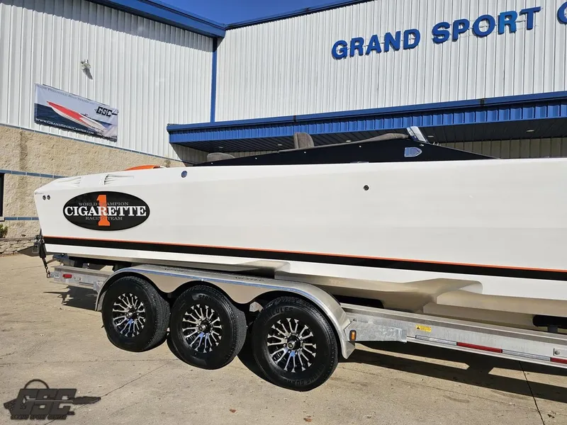 Slide: The Image of 2003 Cigarette 36 Gladiator boat on trailer at Grand Sport Center. - 5