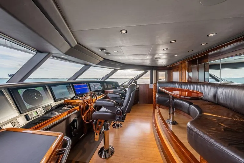 Slide: The Image of Luxurious 2013 Westport W164 yacht interior with modern navigation equipment and plush seating. - 11