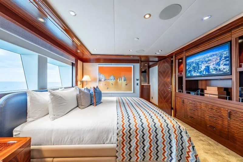 Slide: The Image of Luxurious 2013 Westport W164 yacht bedroom with ocean view, modern decor, and entertainment system. - 30