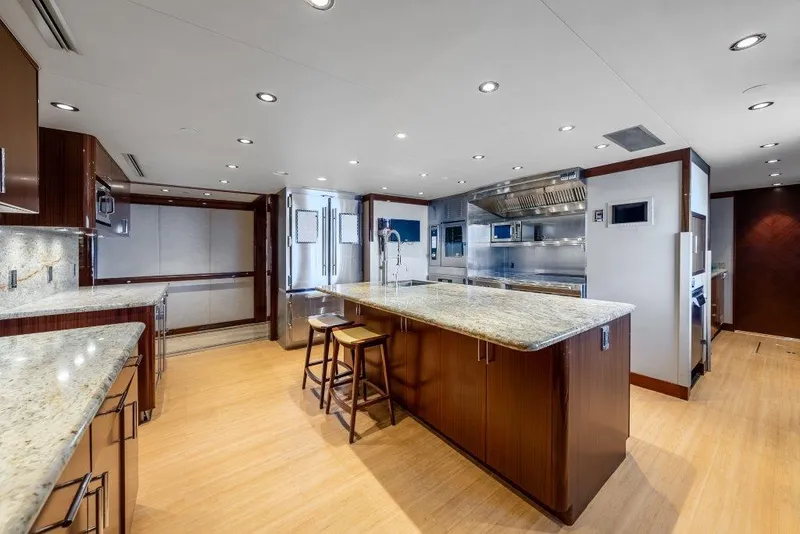 Slide: The Image of Spacious modern kitchen on 2013 Westport W164 yacht with granite countertops and wooden flooring. - 32