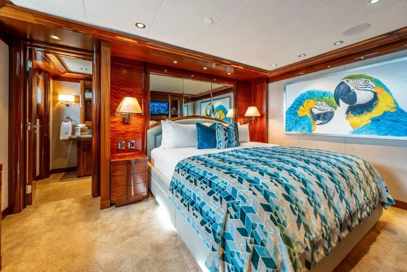 Slide: The Image of Luxurious 2013 Westport W164 yacht bedroom with vibrant parrot artwork and elegant decor. - 34