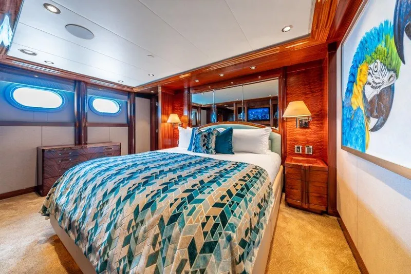 Slide: The Image of Luxurious 2013 Westport W164 yacht bedroom with vibrant decor and elegant wood finishes. - 36