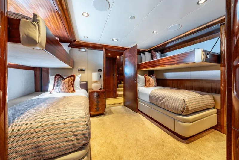 Slide: The Image of Luxurious 2013 Westport W164 yacht cabin with twin beds and elegant wood finishes. - 38